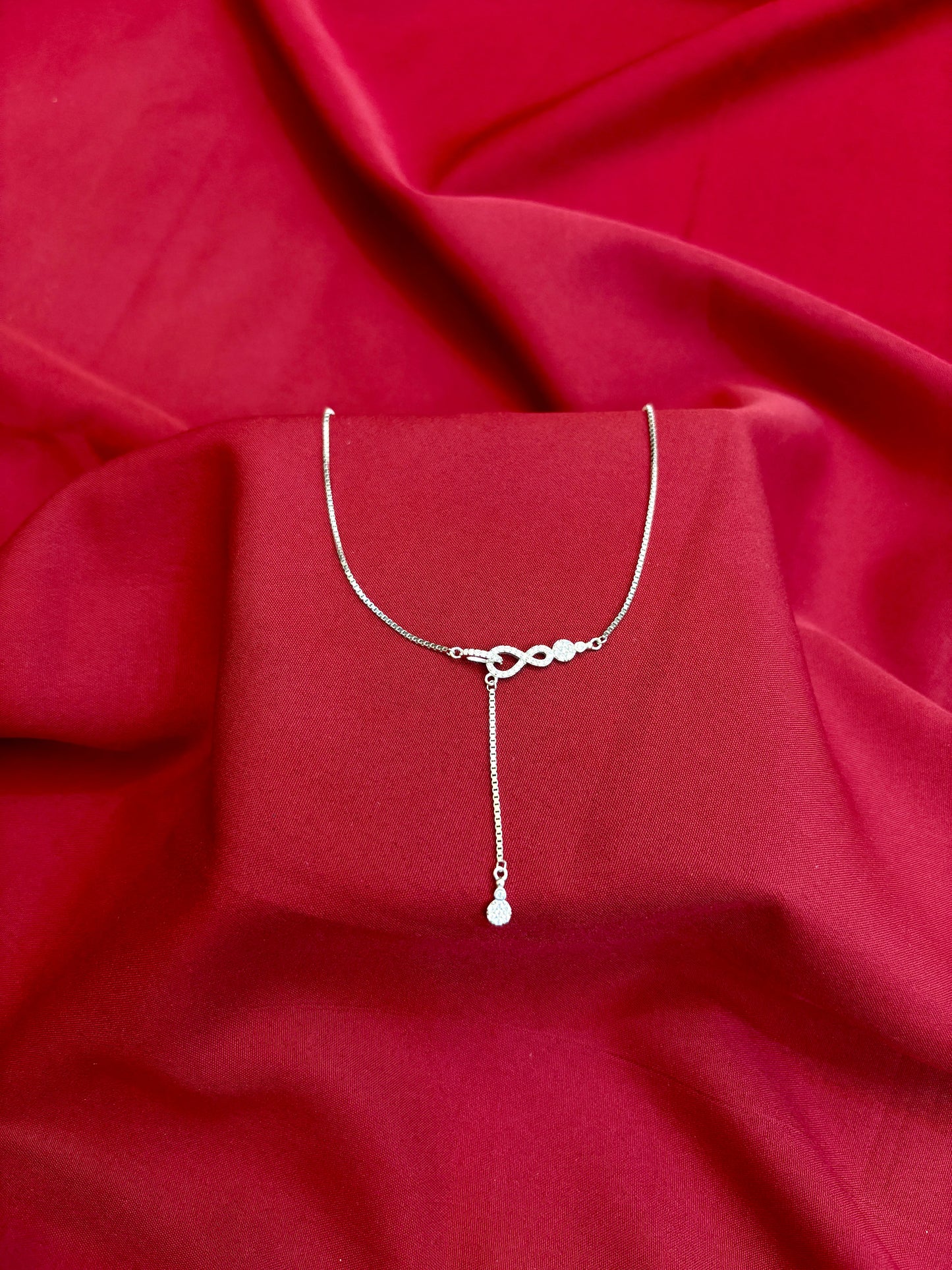 Infinity Knot Drop Silver Pendant - Eraya Jewellery