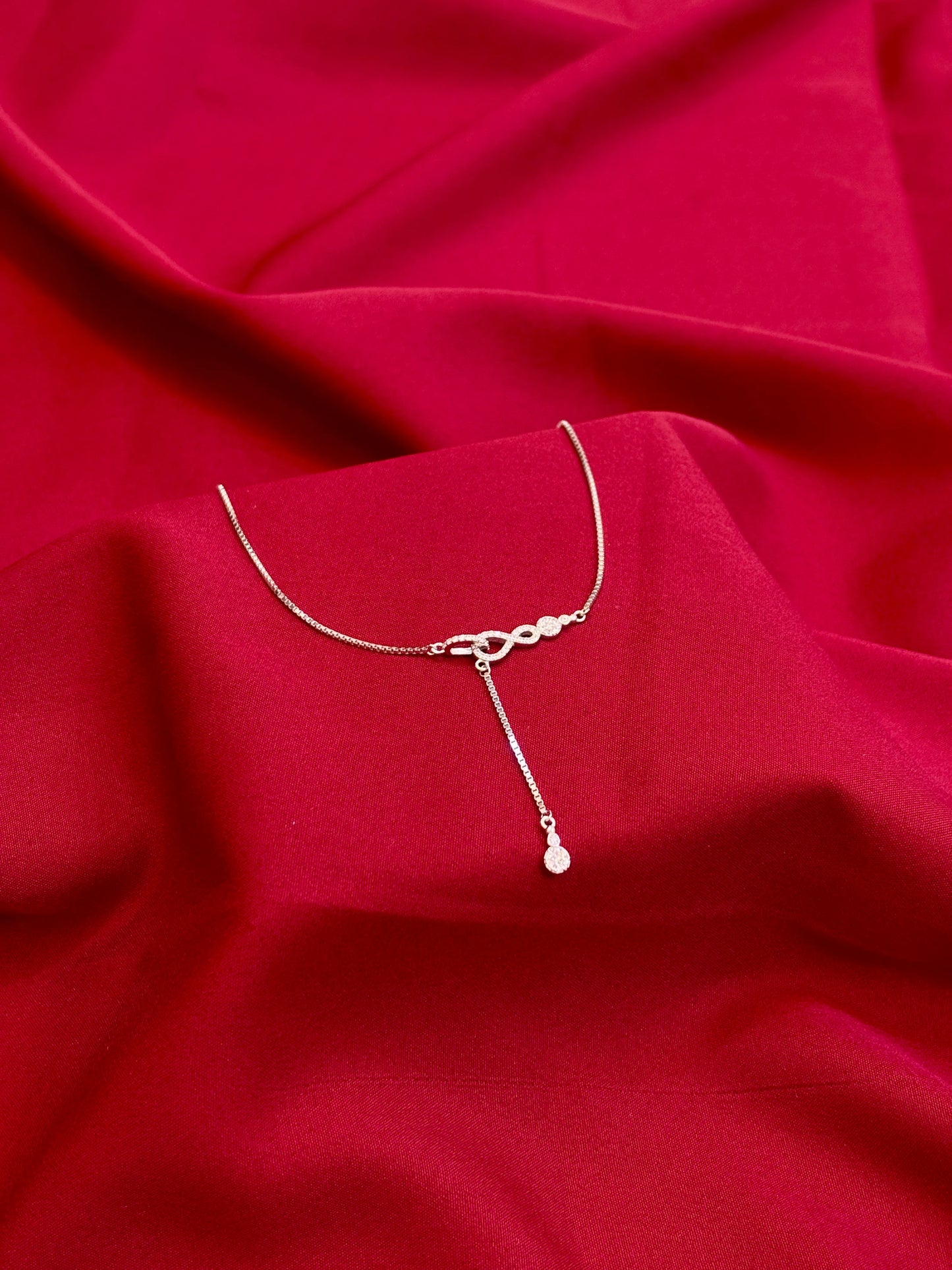 Infinity Knot Drop Silver Pendant - Eraya Jewellery