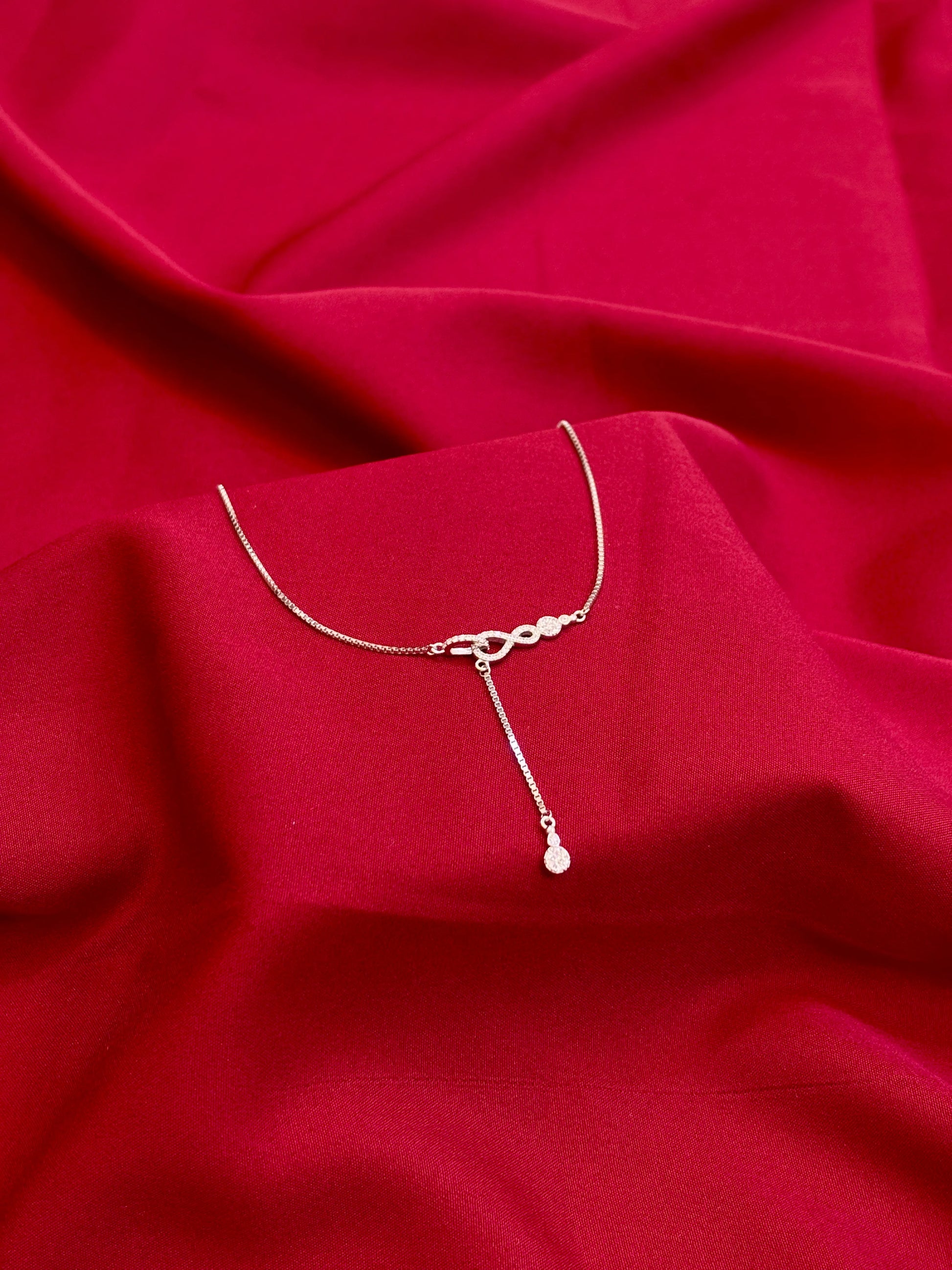 Infinity Knot Drop Silver Pendant - Eraya Jewellery